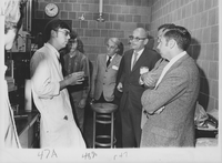 John E Unbehend left in labcoat