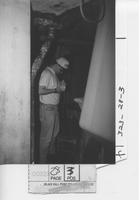 Student obtaining samples and measurements during paper machine run