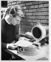 Student making a standard hand-sheet with hand-sheet mold