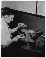 Pulp and Paper student using a burst tester